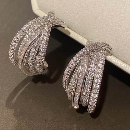 These stunning multi-layer earrings are adorned with intricate synthetic zirconia stones. The elegant C-shaped design makes them perfect for women to wear on their everyday outings, special occasions, or high-end events.