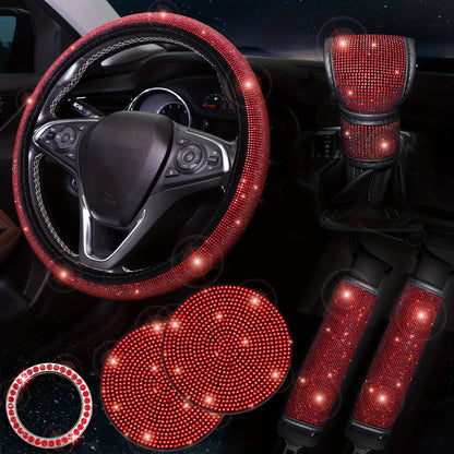 Women's bling car accessories: steering wheel cover, coasters, seat belt shoulder pads, ring sticker, and gear shift cover.