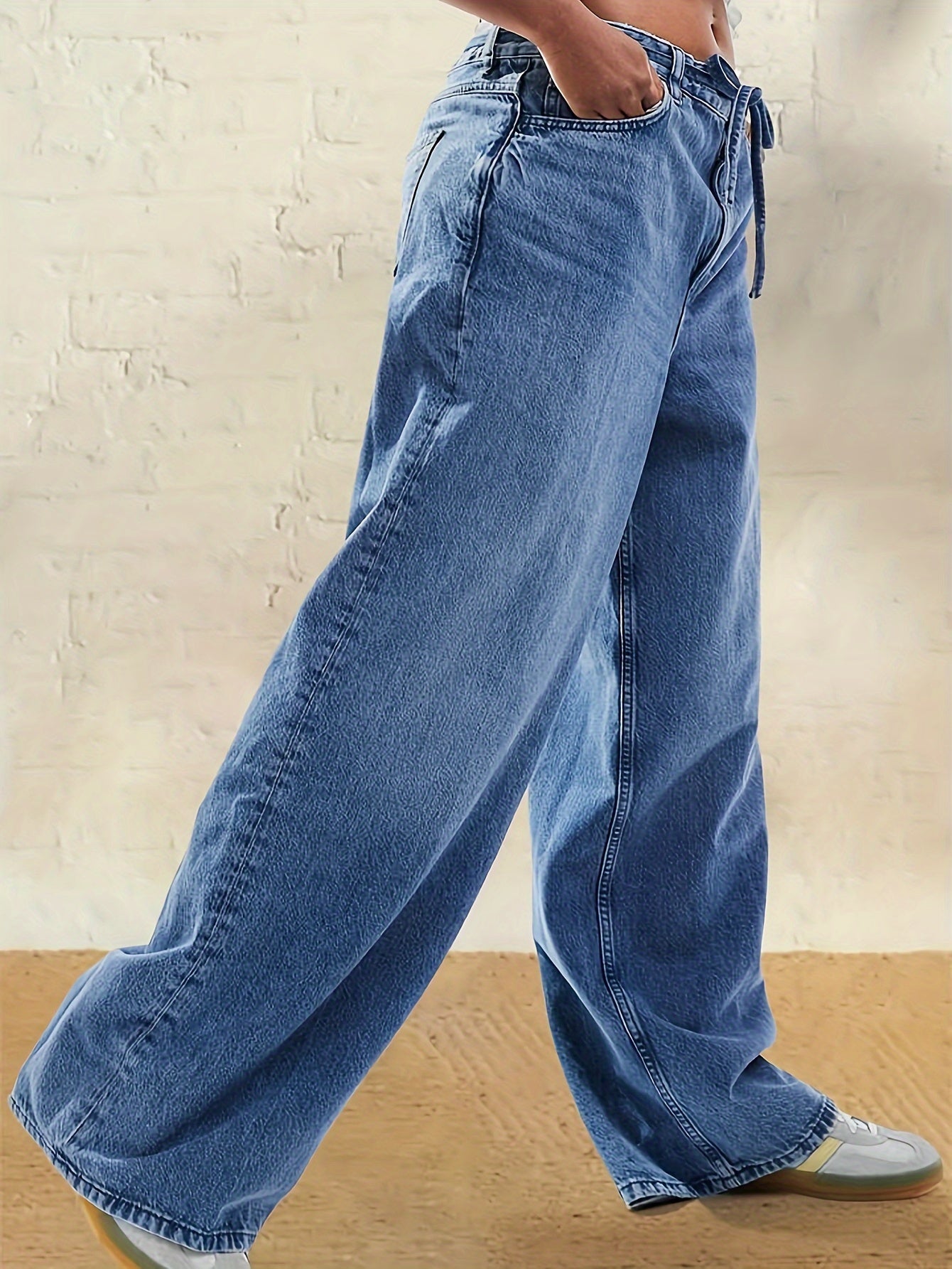 Plus Size High-Rise Wide Leg Denim Jeans in Casual Light Blue. Comfortable, adjustable waistband for all seasons. Casual, relaxed style in a rayon blend.