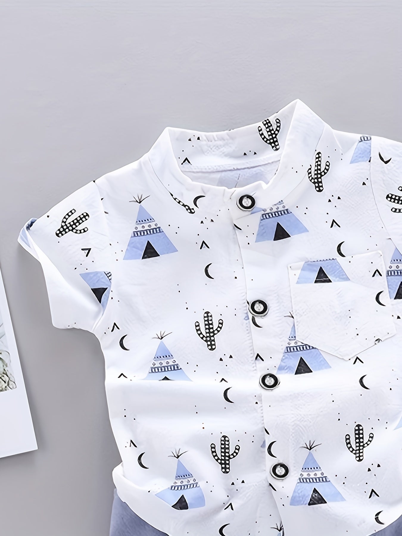 Boys' casual gentleman set with pyramid print, including standing collar button-up shirt and shorts. Comfortable and loose fit for outdoor activities.