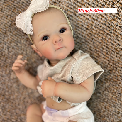 20" lifelike waterproof vinyl reborn girl doll with realistic 3D painted skin and hand-painted hair. Bathable and comes in a comfy gray outfit with headband. Perfect for girls.