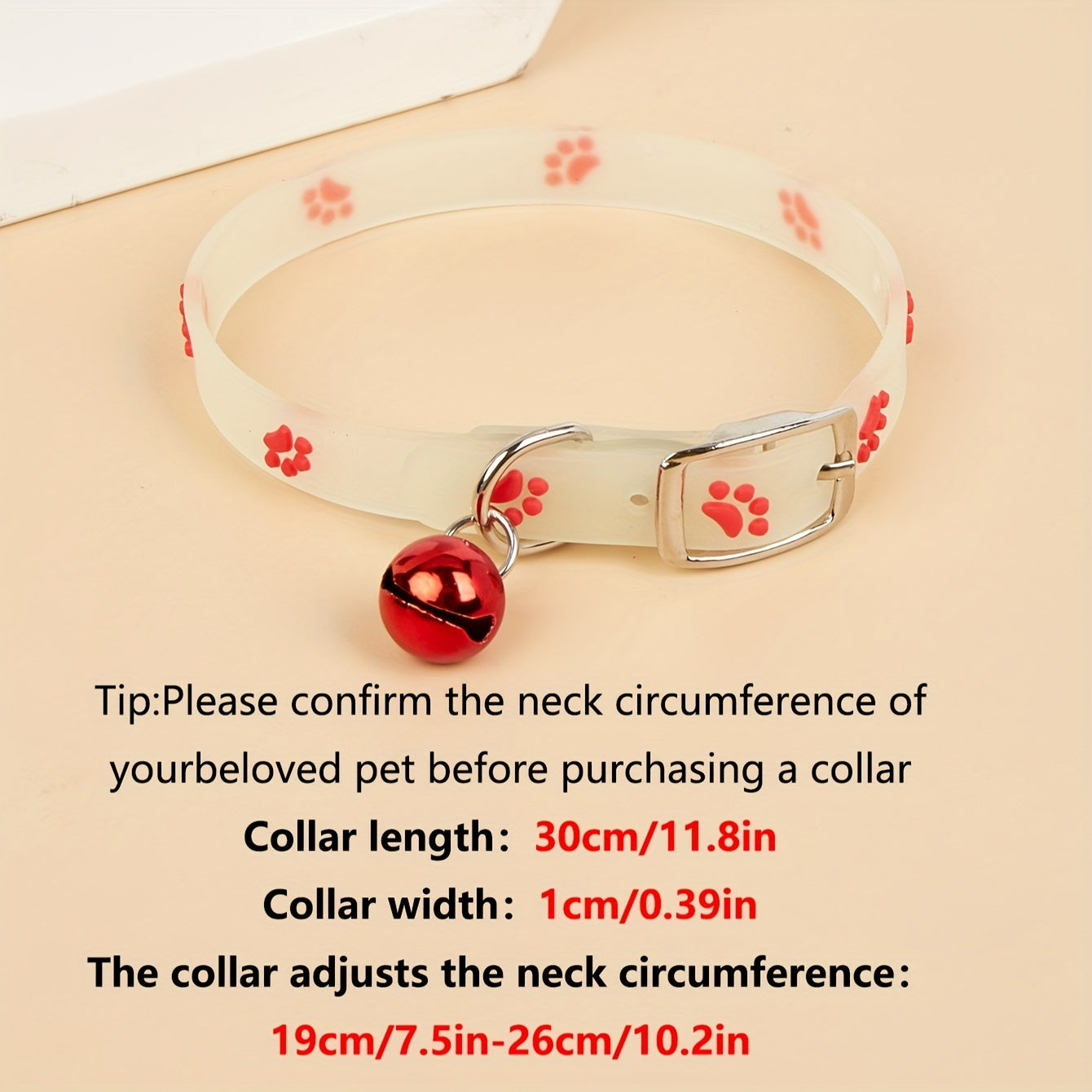 Adjustable glow-in-the-dark cat collar with colorful paw print for easy spotting at night.