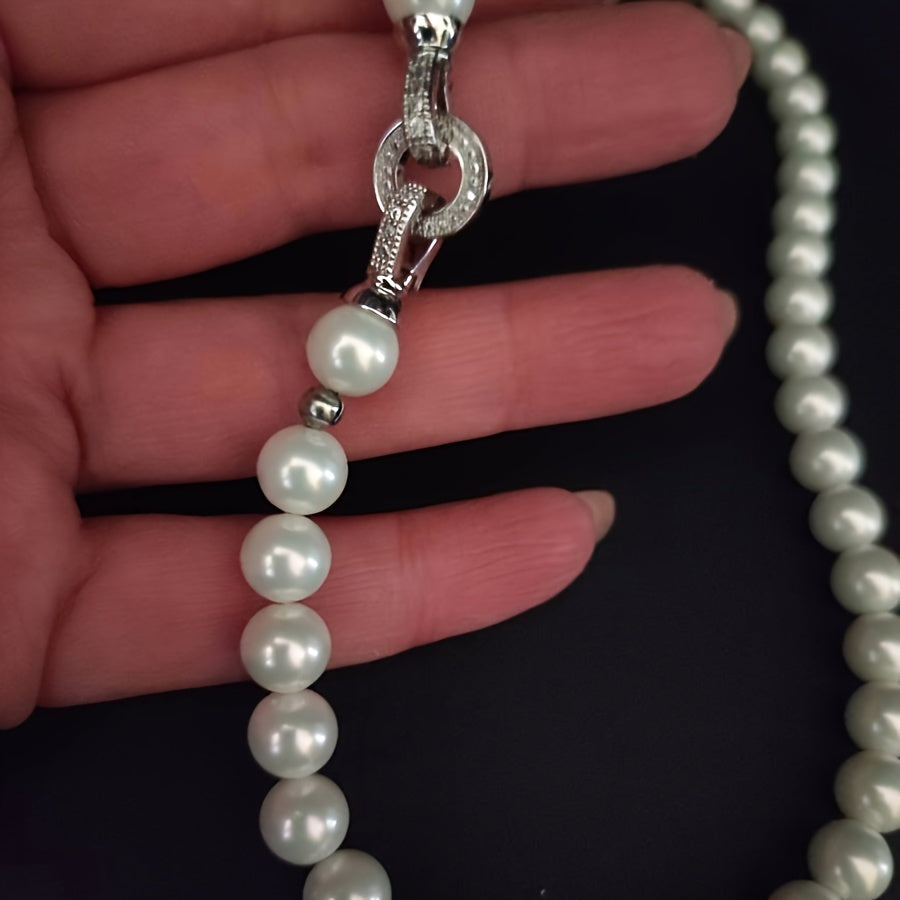 Impeccably crafted from natural freshwater pearls measuring 7-8mm, this stunning necklace features a silvery diamond round buckle. Presented in an elegant gift box, it is suitable for both male and female recipients and perfect for everyday wear