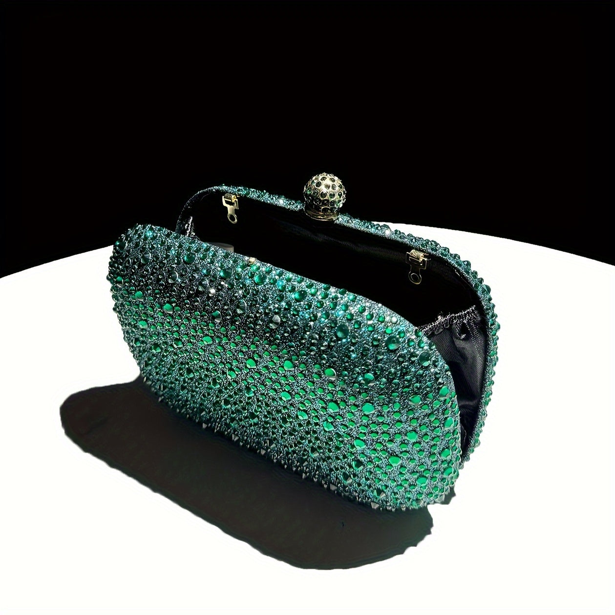 Stylish emerald green handbag with golden chain, suitable for formal events and as a gift for women.