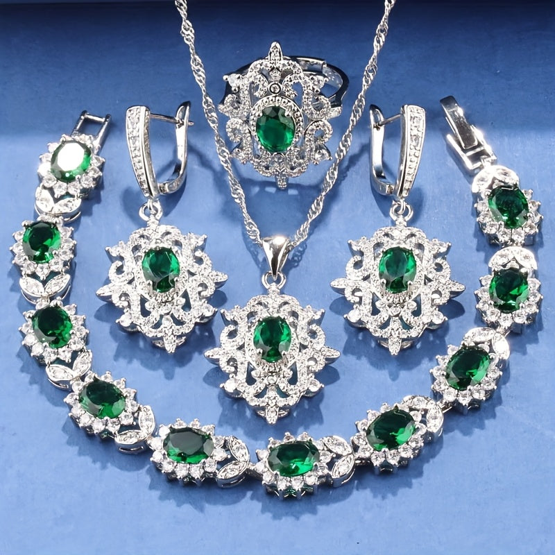 Luxurious and elegant jewelry set featuring 5 pieces in 18K gold plated copper, adorned with synthetic emerald and cubic zirconia. Set includes earrings, necklace, pendant, ring, and bracelet, perfect for both daily wear and special occasions. A stunning