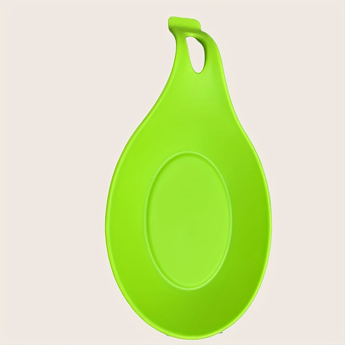 Durable, non-slip silicone spoon pad for kitchen utensils, heat-resistant and easy to clean.