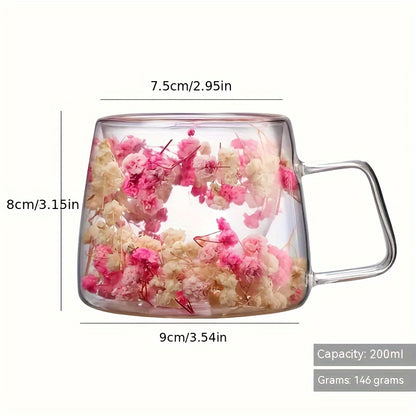 Elegant floral glass coffee mug with real dried flowers, double-walled insulated design in pink and clear. Hand wash only, BPA-free. Perfect for tea or coffee at home.