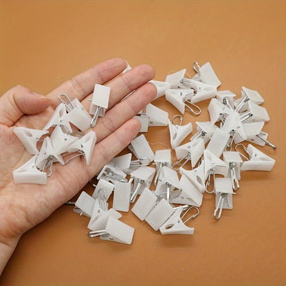 This 20-piece set of white plastic clothespins is ideal for hanging curtains, bathrobes, and other items. Please note that these clothespins should be hand washed only.