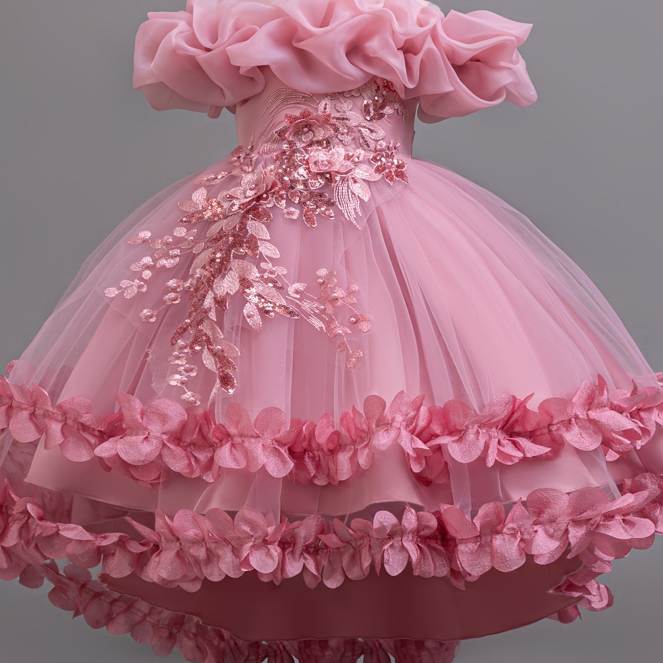 Sleeveless princess dress for girls with high-low hem, floral appliques, belt detail, and breathable polyester blend.