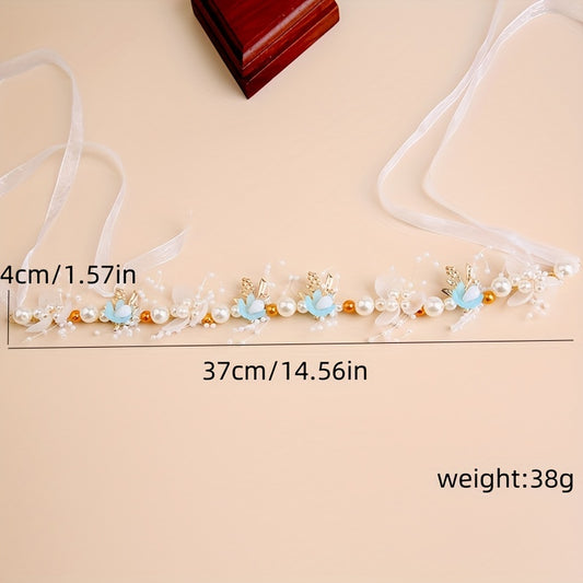 Elegant white plastic headband with floral design for girls, perfect for performances and vacations.