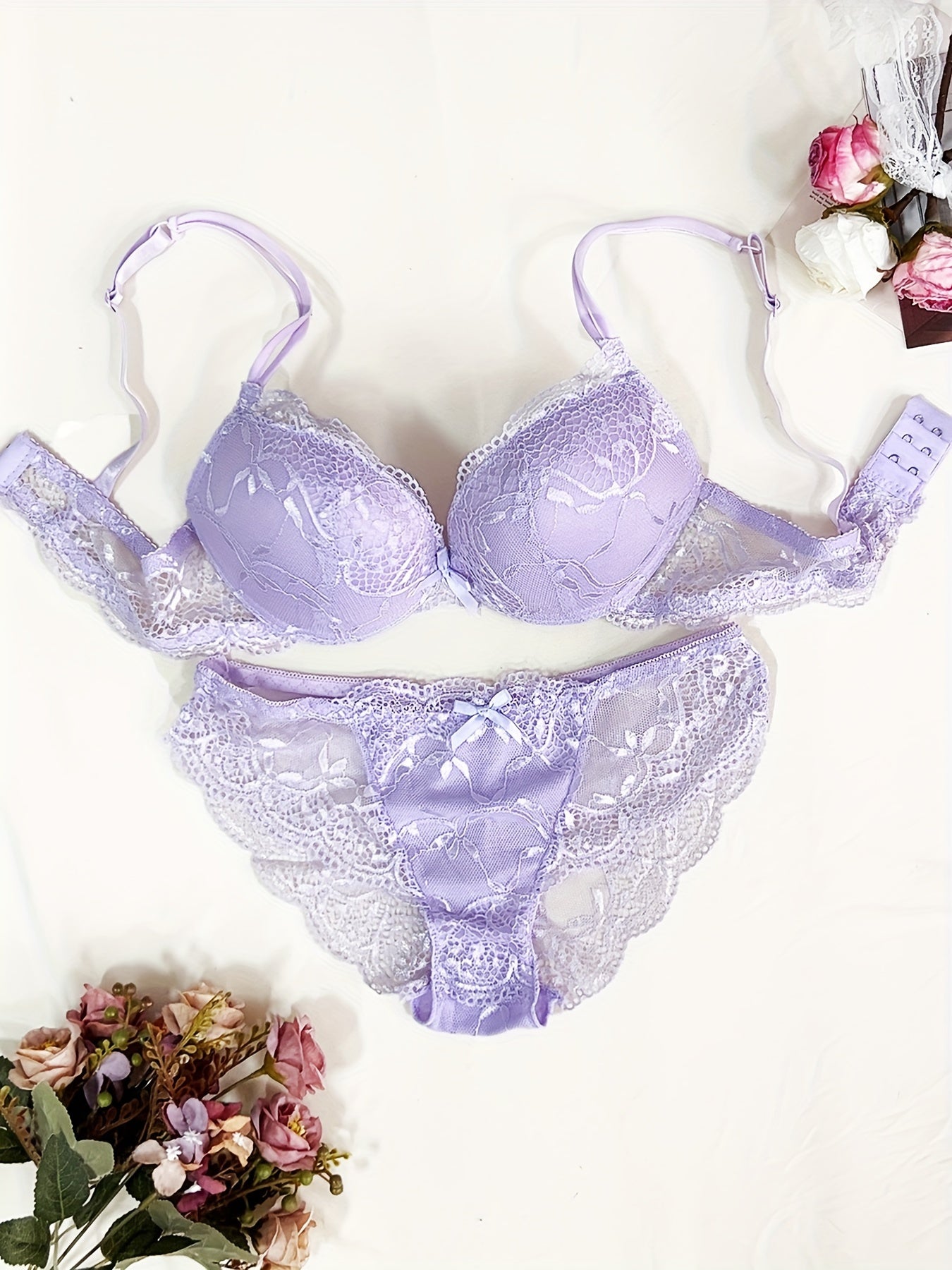 Medium support lace bra and panty set with contrast lace detail, made of 85% polyamide, 7% polyester, 5% elastane, and 3% viscose. Features drop waist briefs and chest pad.