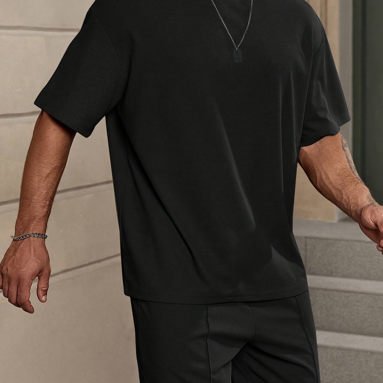 Men's 2-piece solid color summer outfit set includes short sleeve crew neck t-shirt and elastic waist shorts with pockets.