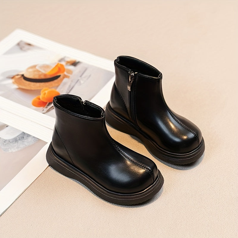 Warm fleece-lined kids' boots with soft soles and zip closure, ideal for outdoor activities in fall and winter.