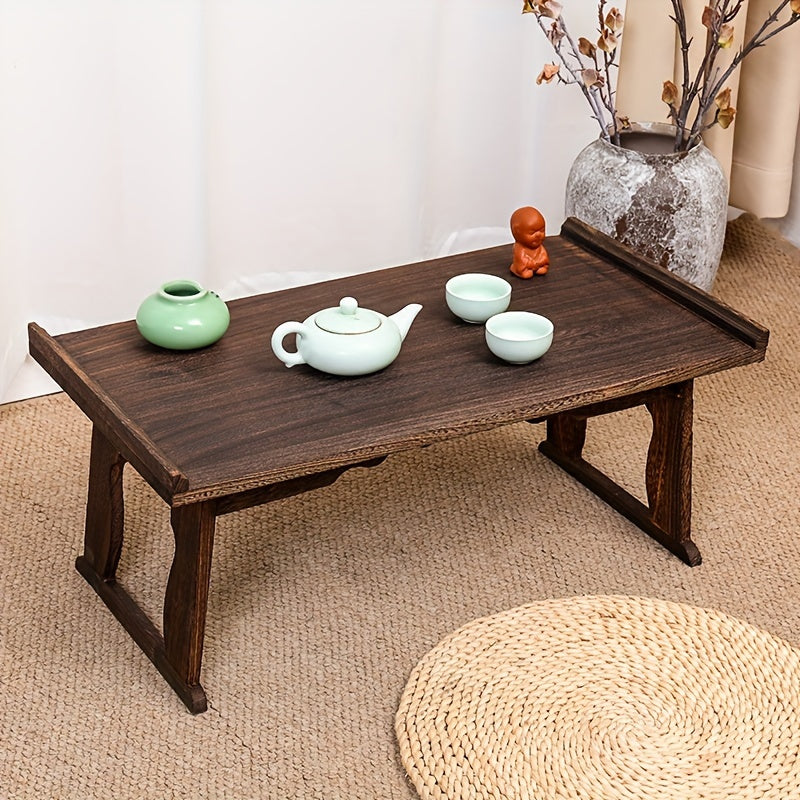 This Japanese-inspired low table is versatile and convenient for meditation, coffee, and bedside use. It features foldable legs and is made of durable Paulownia wood.