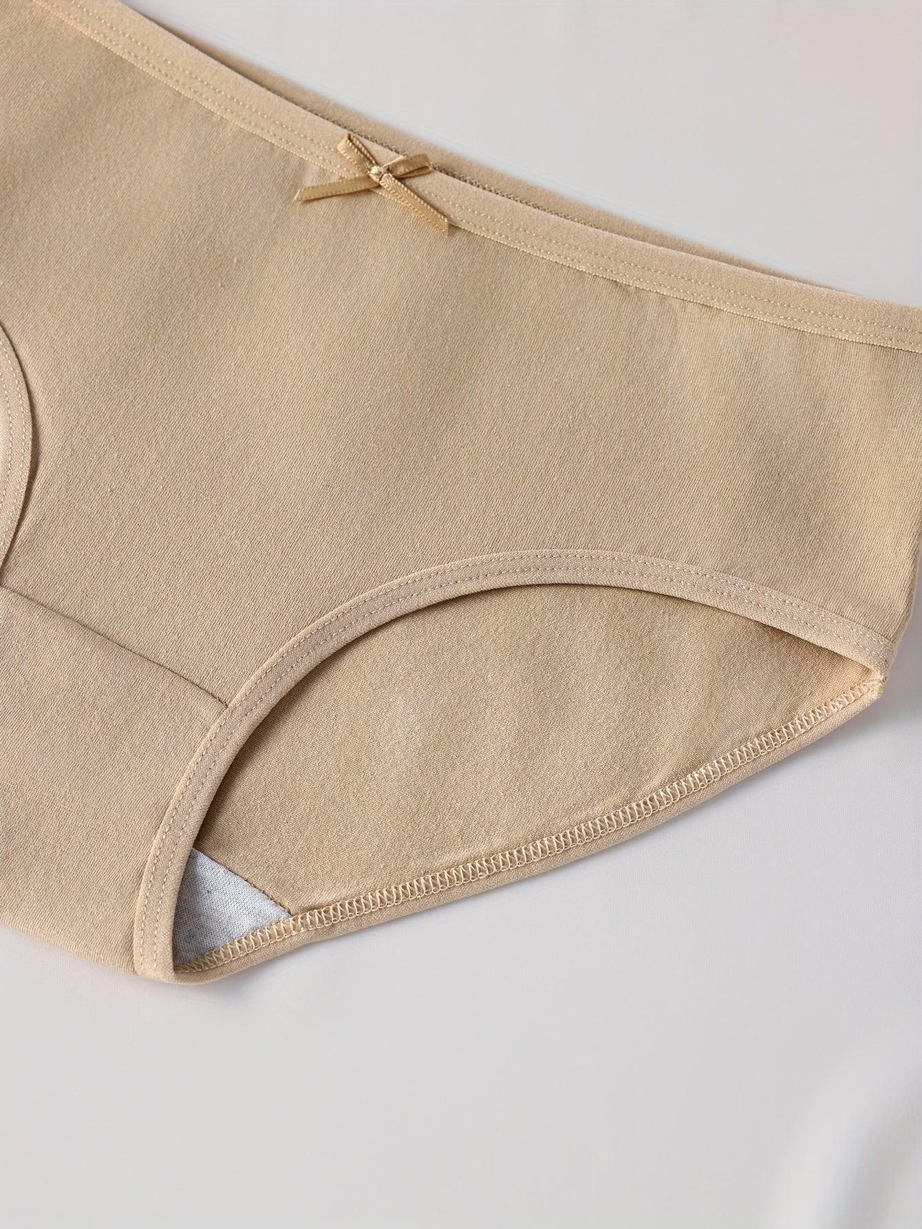 4 Women's Low-Rise Briefs in Dark Tones with Bow Detail - Soft, Stretchy, and Comfortable Everyday Wear.