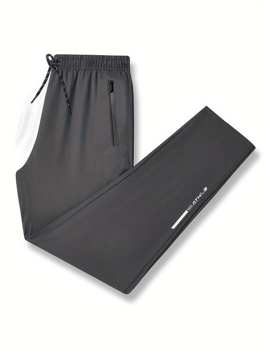 Men's loose-fit polyester pants, breathable and quick-drying, perfect for running and fitness. Features regular length, zipper detail, and printed pattern, ideal for spring and fall.