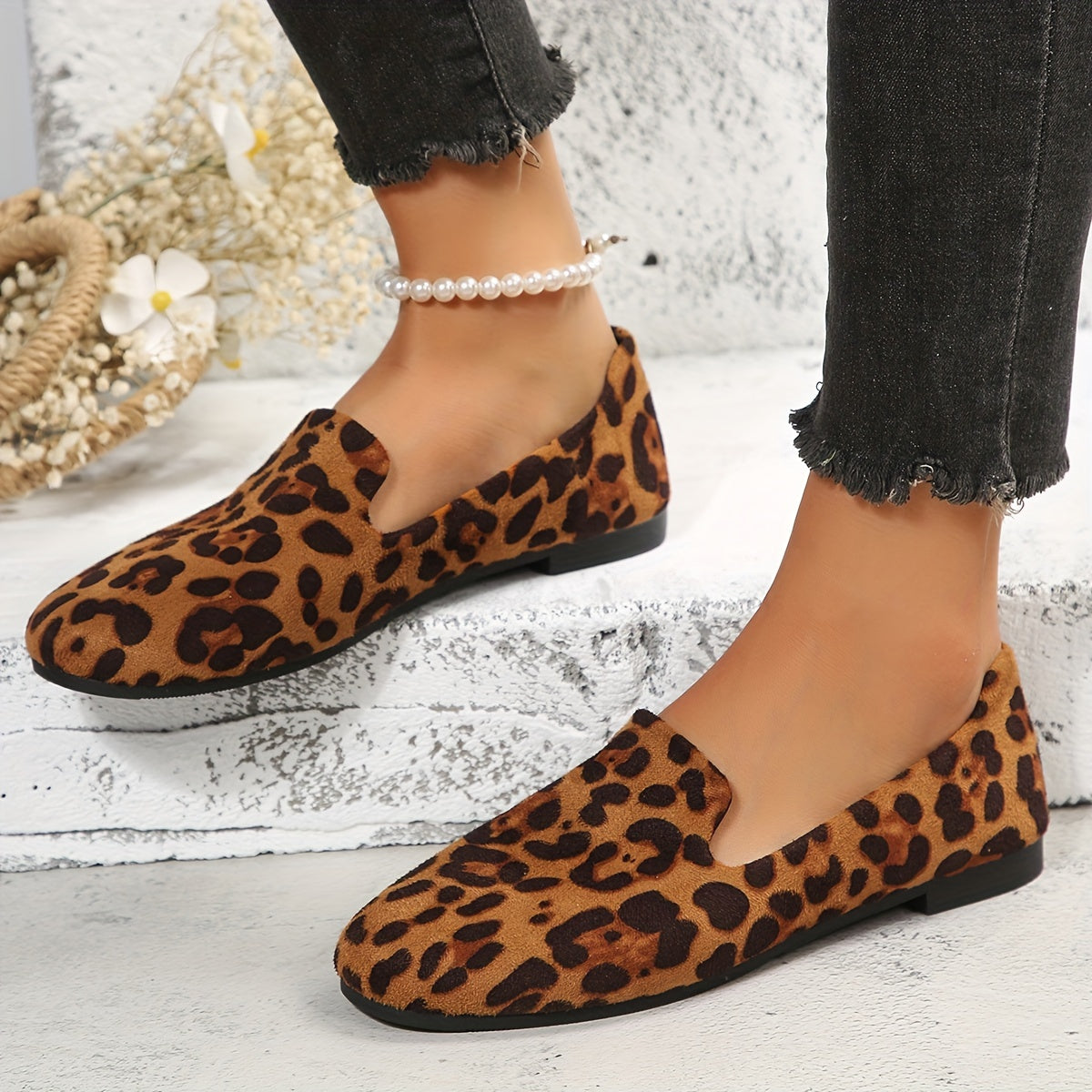 Leopard print women's flats with lightweight slip-on design, plain toe, fabric upper, and plastic sole - perfect for all seasons and versatile boat-style footwear.