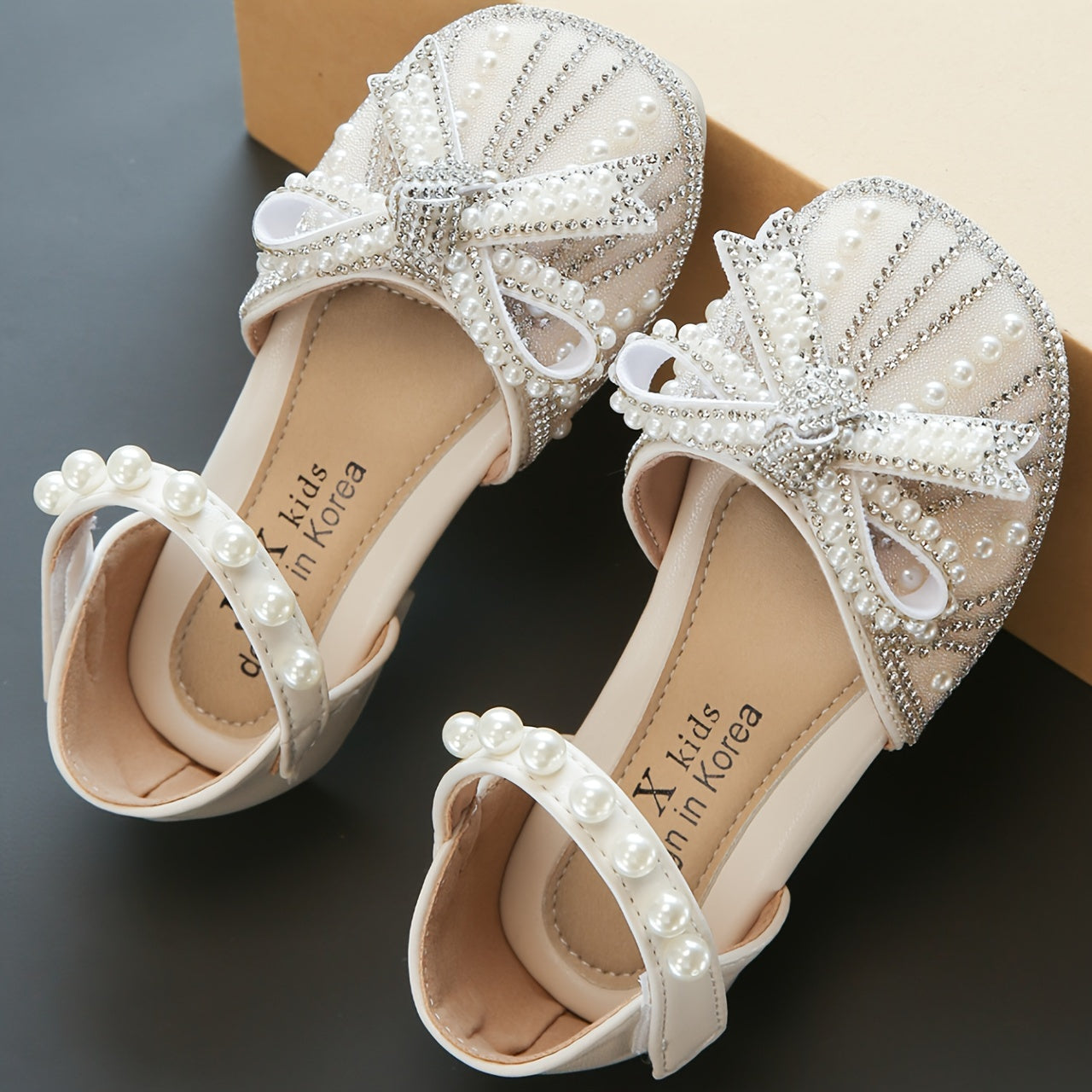 Sparkly bowknot flats with adjustable strap, durable TPR sole, comfortable for daily wear for girls aged 14 and under.