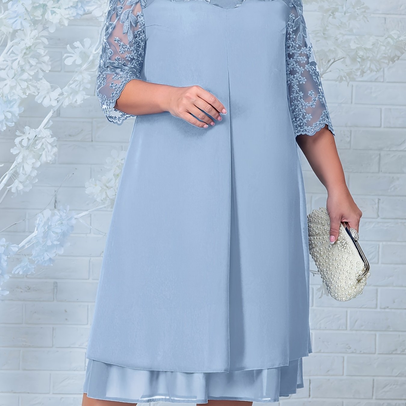 Chic plus size mother of the bride dress with embroidered chiffon patchwork and round neckline.