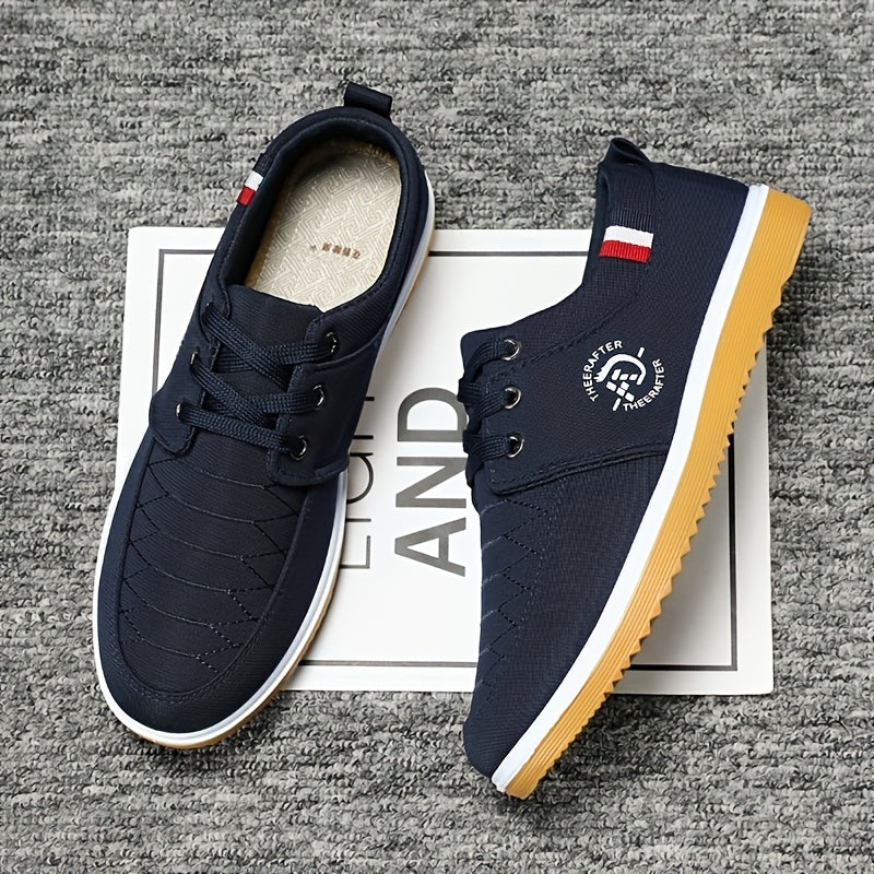 Men's breathable canvas sneakers with fabric lining, rubber sole, and lace-up closure.