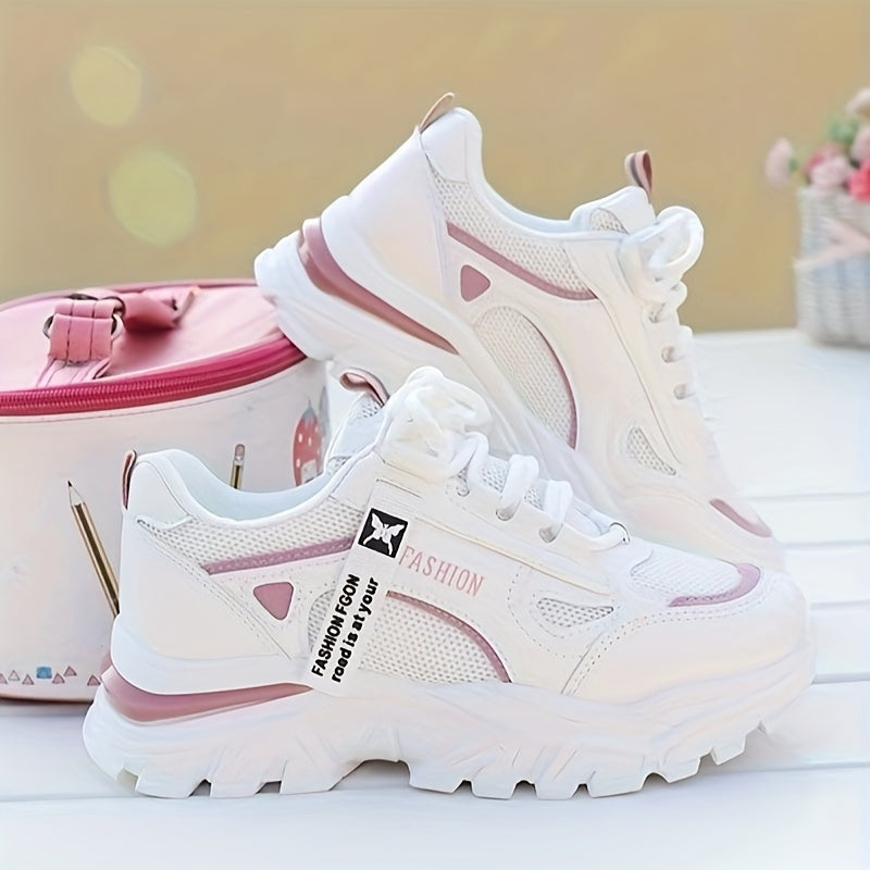 Women's white sneakers with low top lace-up, mesh upper, breathable fabric insole, and durable PVC sole for casual and sporty wear. Casual and trendy footwear.