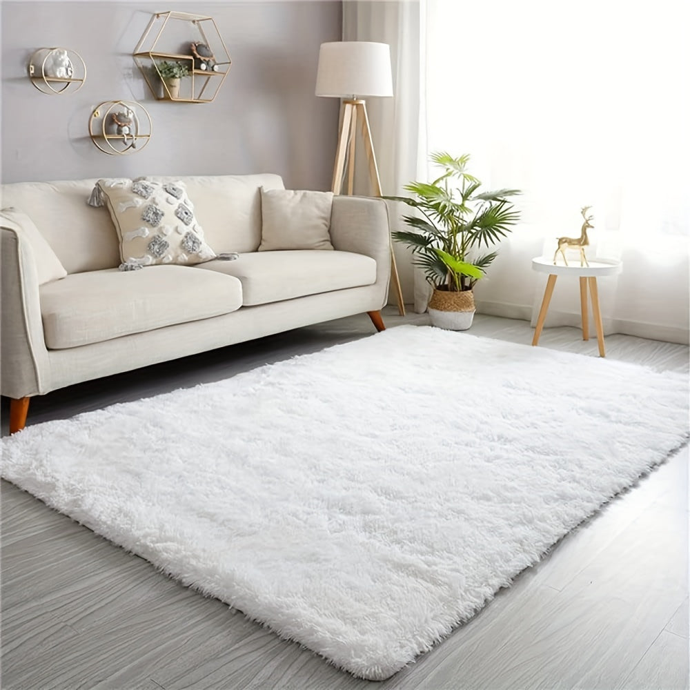 Soft and luxurious pure white plush area rug, ideal for bedroom, living room, and dorm décor. Made from machine washable polyester for easy care.