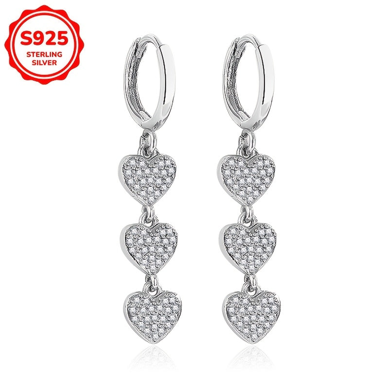 These exquisite ladies' earrings feature dazzling heart-shaped pendants embellished with synthetic zirconia, set in 925 silver. Weighing 3.6g, they are perfect for both daily wear and special occasions such as banquets.