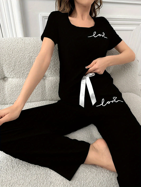 Women's casual lounge set with letter print, short sleeve top, and pants in a comfortable relaxed fit.