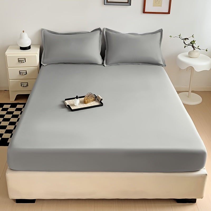 Soft and breathable microfiber fitted sheet in deep blue, stain-resistant, machine washable, all-season comfort bedding with solid color design and woven texture.