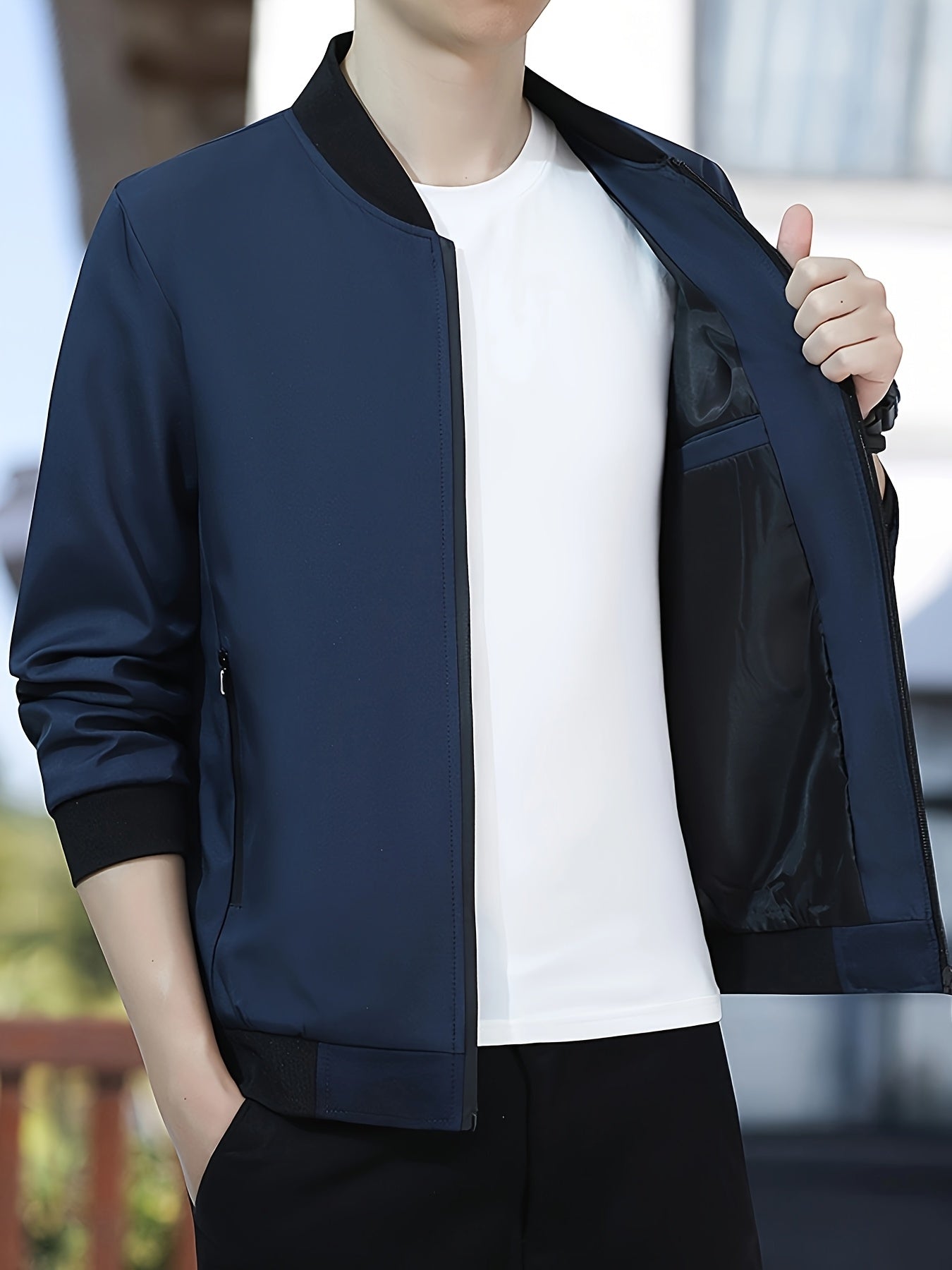 Long-sleeve, solid color men's jacket with small stand collar and zipper closure, perfect for outdoor activities.