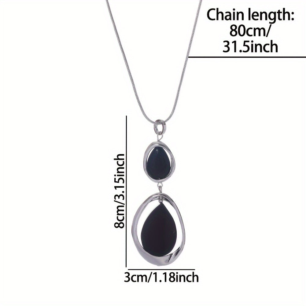 A stylish and sophisticated black stone geometric pendant necklace, perfect for women's accessories. Made from trendy zinc alloy, this long necklace is ideal for daily wear, parties, proms, vacations, and makes a great jewelry gift.