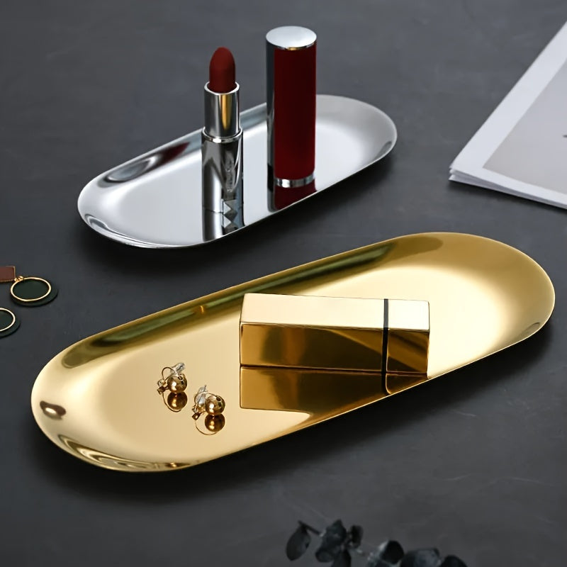 Elegant golden stainless steel tray for makeup, perfume, jewelry, and bathroom decor with an artistic design and sink organizer.