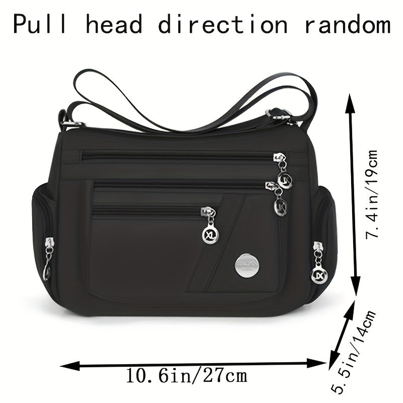 Stylish waterproof nylon crossbody bag with adjustable strap and multi-layer design, ideal for daily commute and travel.