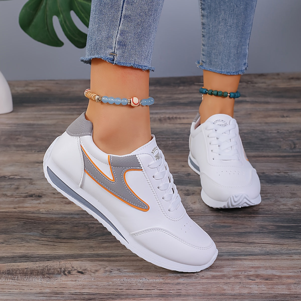 Trendy colorblock women's sneakers with soft platform sole, lace-up design, perfect for casual walking.