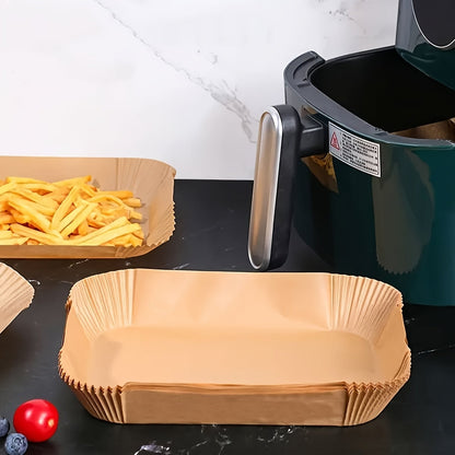 A set of 100 Non-Stick Disposable Air Fryer Liners made from oil-resistant parchment paper. These trays are oven safe and are kitchen accessories that provide chemical-free cooking supplies.