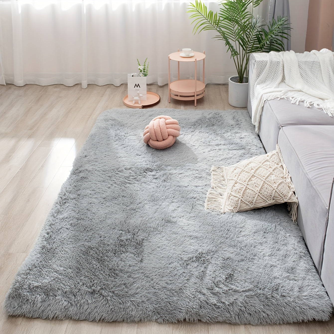 Soft and fluffy rectangle area rug perfect for your bedroom. This plush carpet is thick and non-slip, making it ideal for your living room. Made with machine-made polyester fiber, this low-pile rug is washable for easy cleaning. Perfect for indoor use.