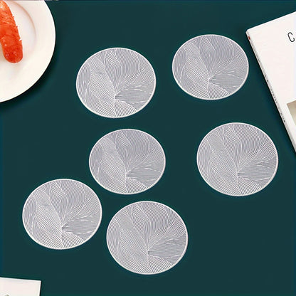 6 PVC round place mats with leaf pattern, heat resistant and non-slip. Hand wash only. Perfect for dining, weddings, and holiday decor.