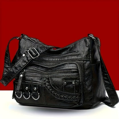 Casual black crossbody bag with multiple zippers for daily use.