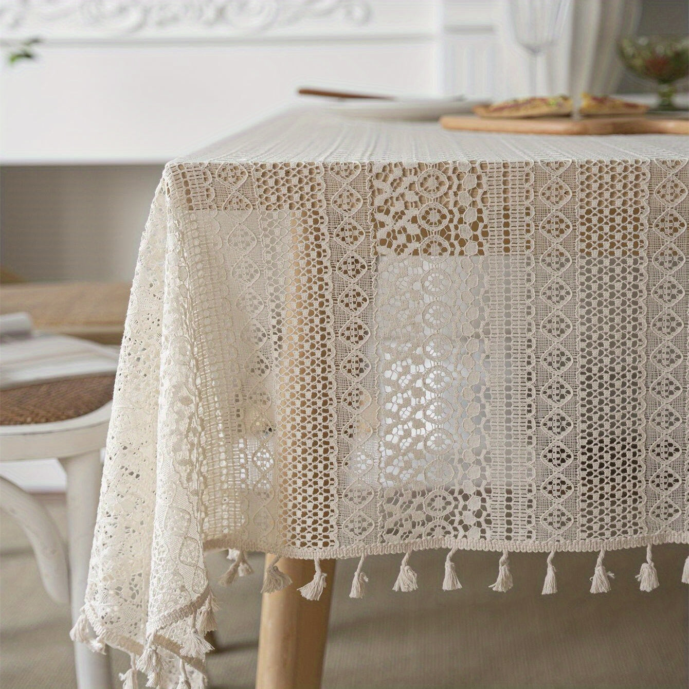 Bohemian chic crochet lace tablecloth, ideal for dining and parties. Rectangular polyester design with a farmhouse style, perfect for boho home decor. Great for buffet tables, banquets, and serving western food.