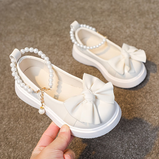 Stylish Mary Jane flats for girls feature pearl and bow accents, perfect for parties and casual wear in spring and fall.