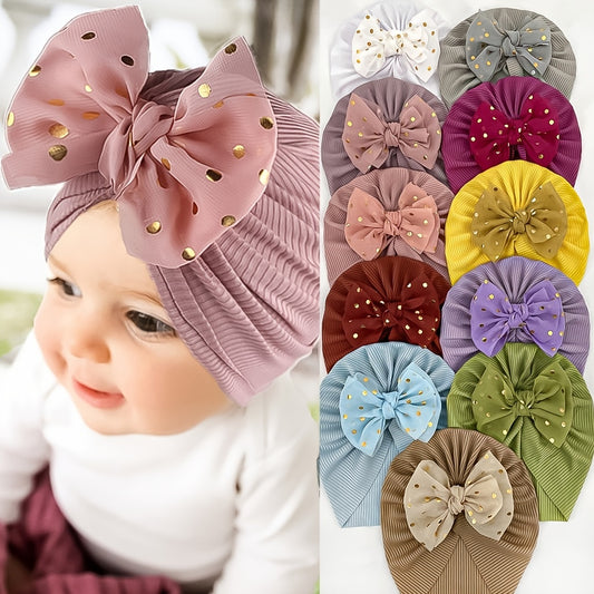 Polka dot printed bow head wrap for newborn infants and toddlers.