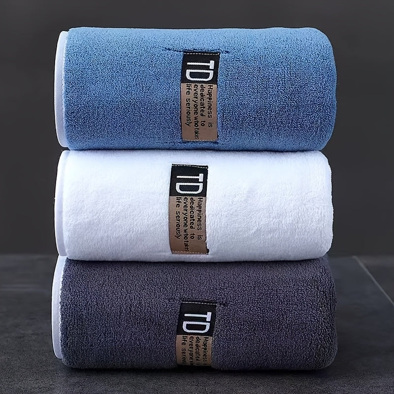 Set of 3 large microfiber bathroom face towels in blue, white, and dark teal with "D" label. Ultra-soft, super absorbent, quick-dry, low-lint, and five-star hotel grade.