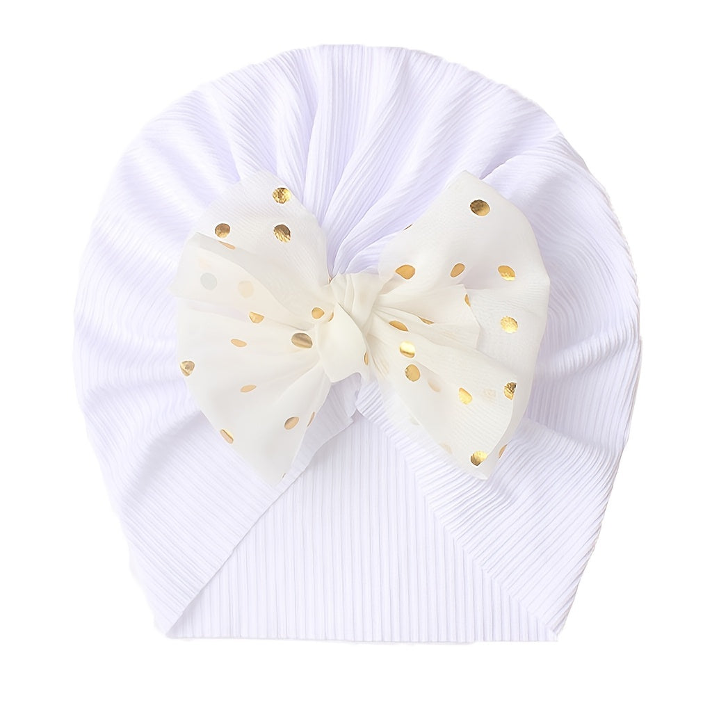 Polka dot printed bow head wrap for newborn infants and toddlers.