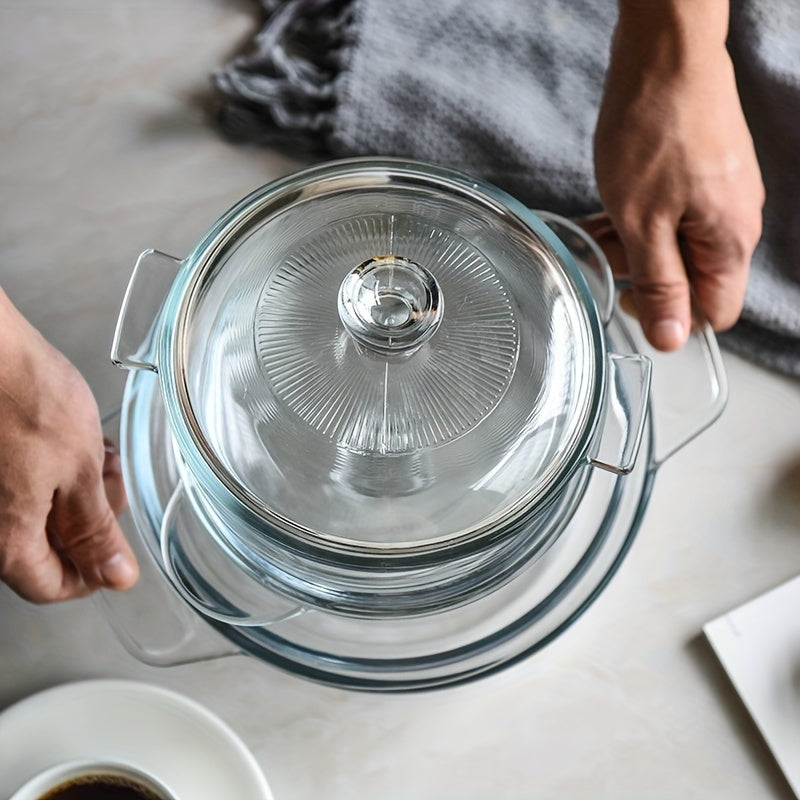 Glass casserole dish with lid designed for oven and microwave use. Dimensions: 28.09cm diameter, 21.11cm depth, with 11.0cm handles. Perfect for baking and cooking.