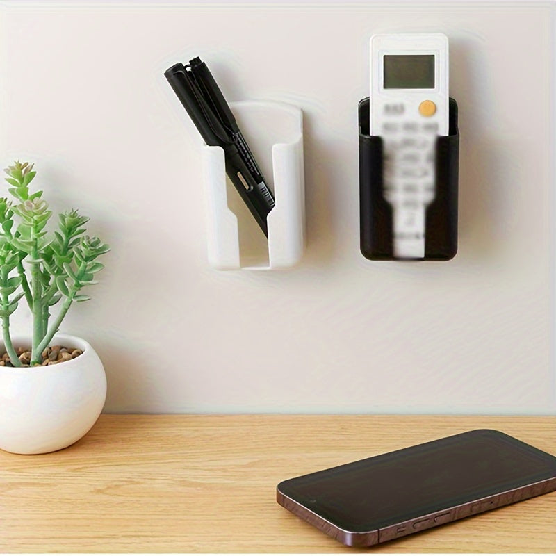 Wall-mounted Remote Control Storage Box for small items in various rooms.