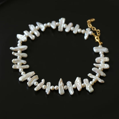 This stunning necklace is inspired by elegant French Baroque style, featuring natural freshwater pearls. The unique clavicle chain is perfect for women to wear on vacations and parties. It comes packaged in a gift box. Please note that natural pearls may