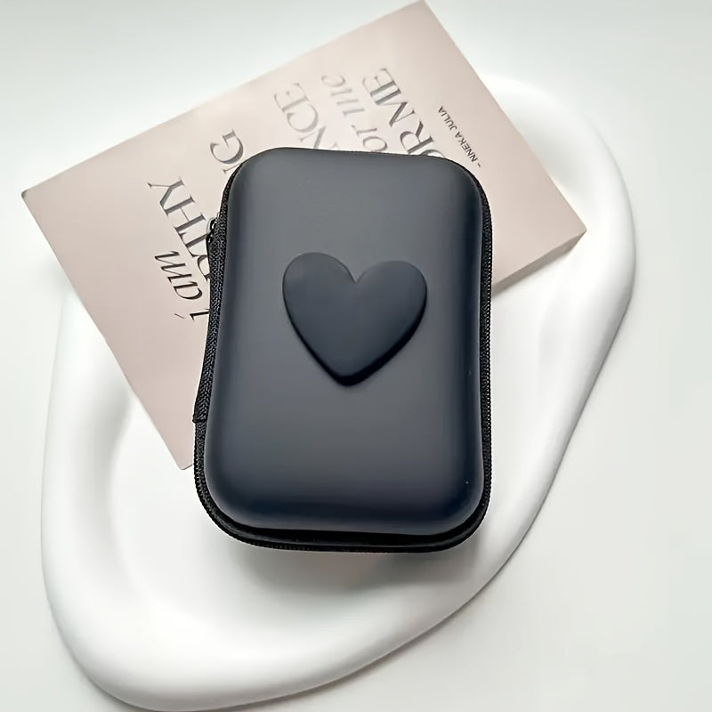 Heart-shaped PU leather case for earphones and charger with zipper closure. Features anti-fall design, cable organizer, and no battery required.