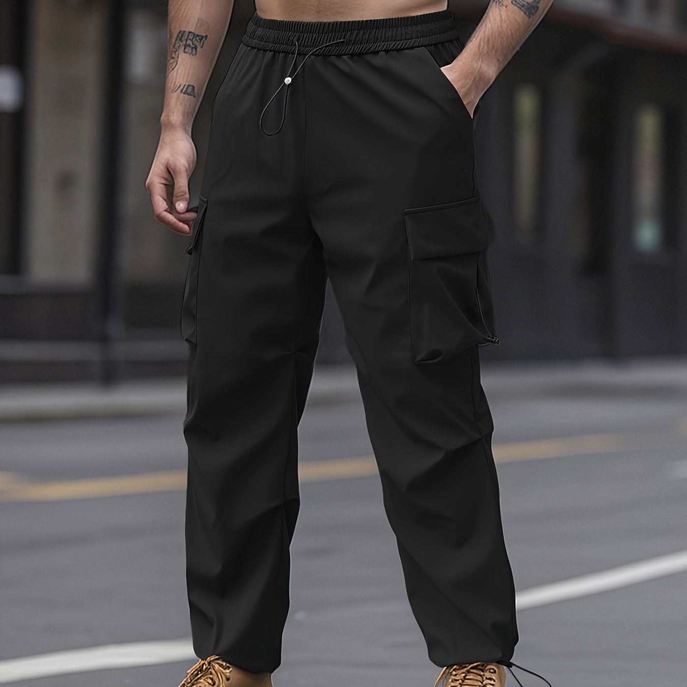 Unisex adult cargo pants with flap pockets, drawstring waist, and solid color.