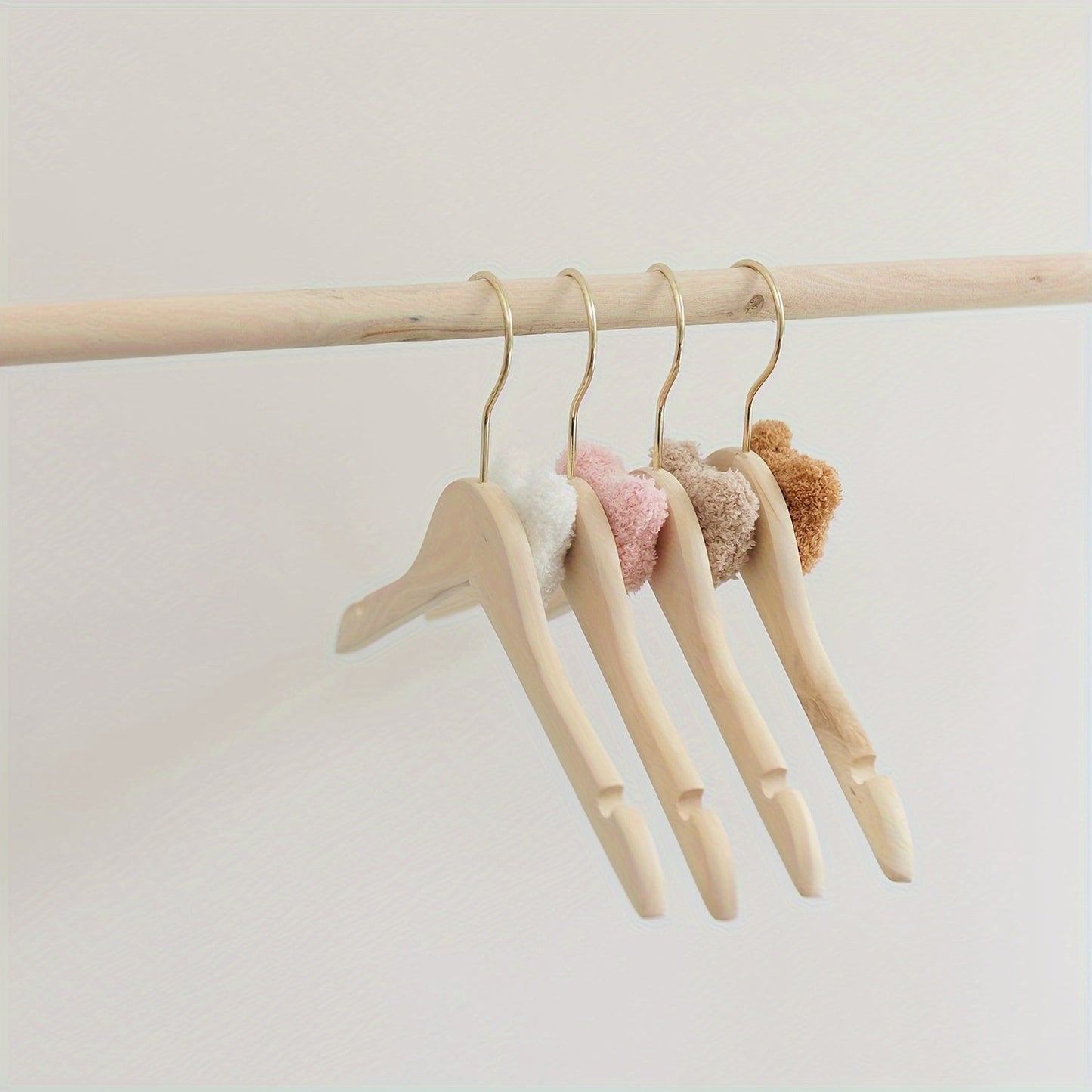 Durable and Lightweight Wooden Clothes Hangers featuring a Nordic Style Cartoon Bear Design, with Swivel Hooks for easy maneuvering. Recommended for Ages 14 and up.