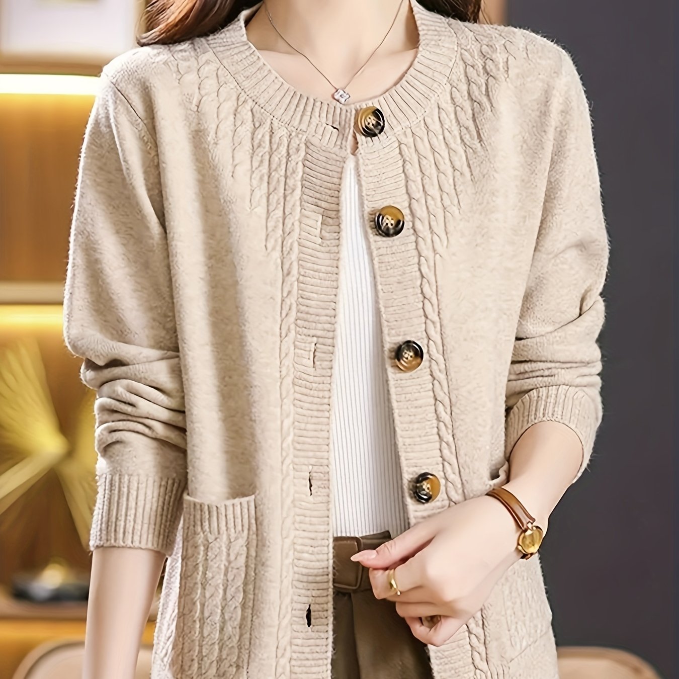 New Spring Collection for Women: Loose-fitting cardigan with round neck, solid color, and unique design, featuring long sleeves.